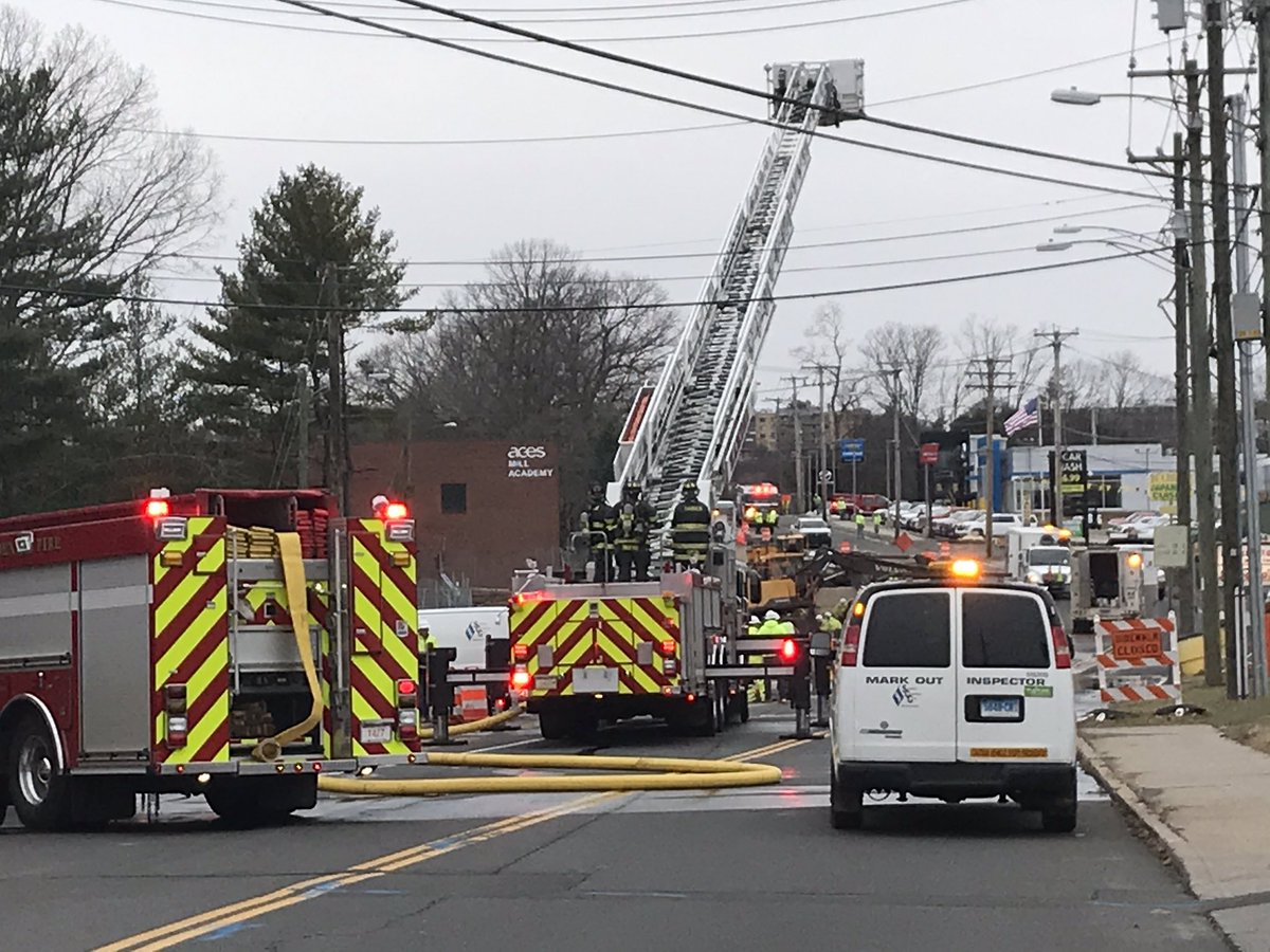 Gas line ruptured by A construction company doing bridge work along Skiff St. in Hamden has caused the road to be closed between Whitney and Dixwell. Businesses and a school were evacuated.