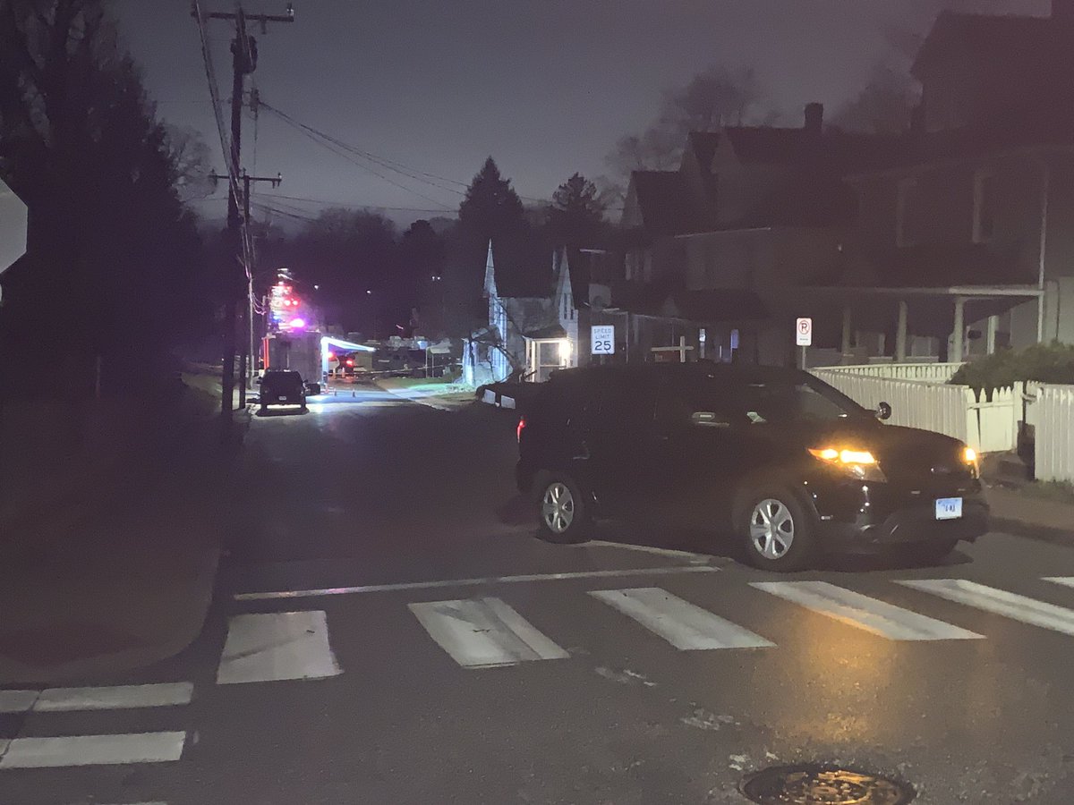 An entire block of Oak St. in Manchester closed off as police continue to look into an officer-involved shooting. The male suspect had allegedly violated parole.