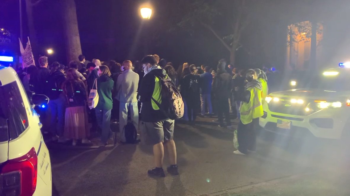 Dozens of students are protesting outside the Yale University president's house Wednesday night in New Haven