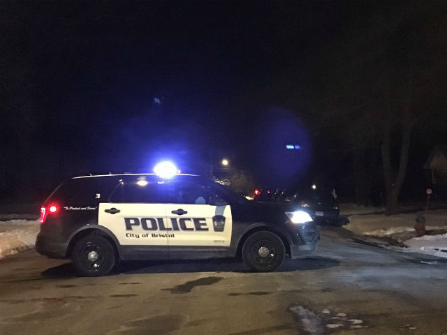 Bristol police say one of their officers had to run out of the way of a vehicle to avoid being struck Monday night